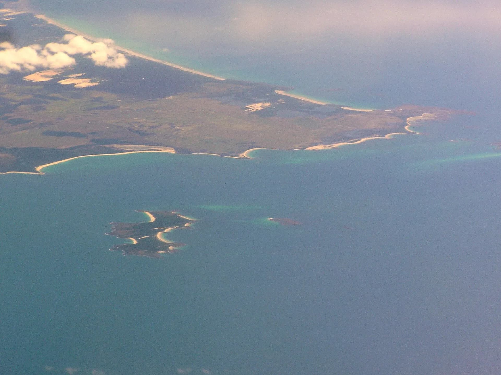 Aerial view across Cape Portland towards offshore islands
