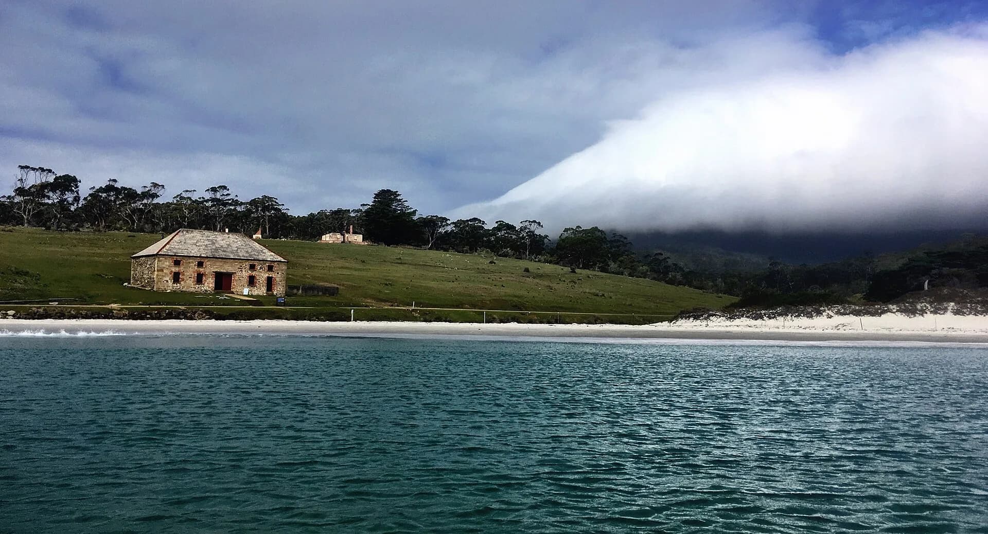 Darlington settlement and open grassland beside the sea on Maria Island