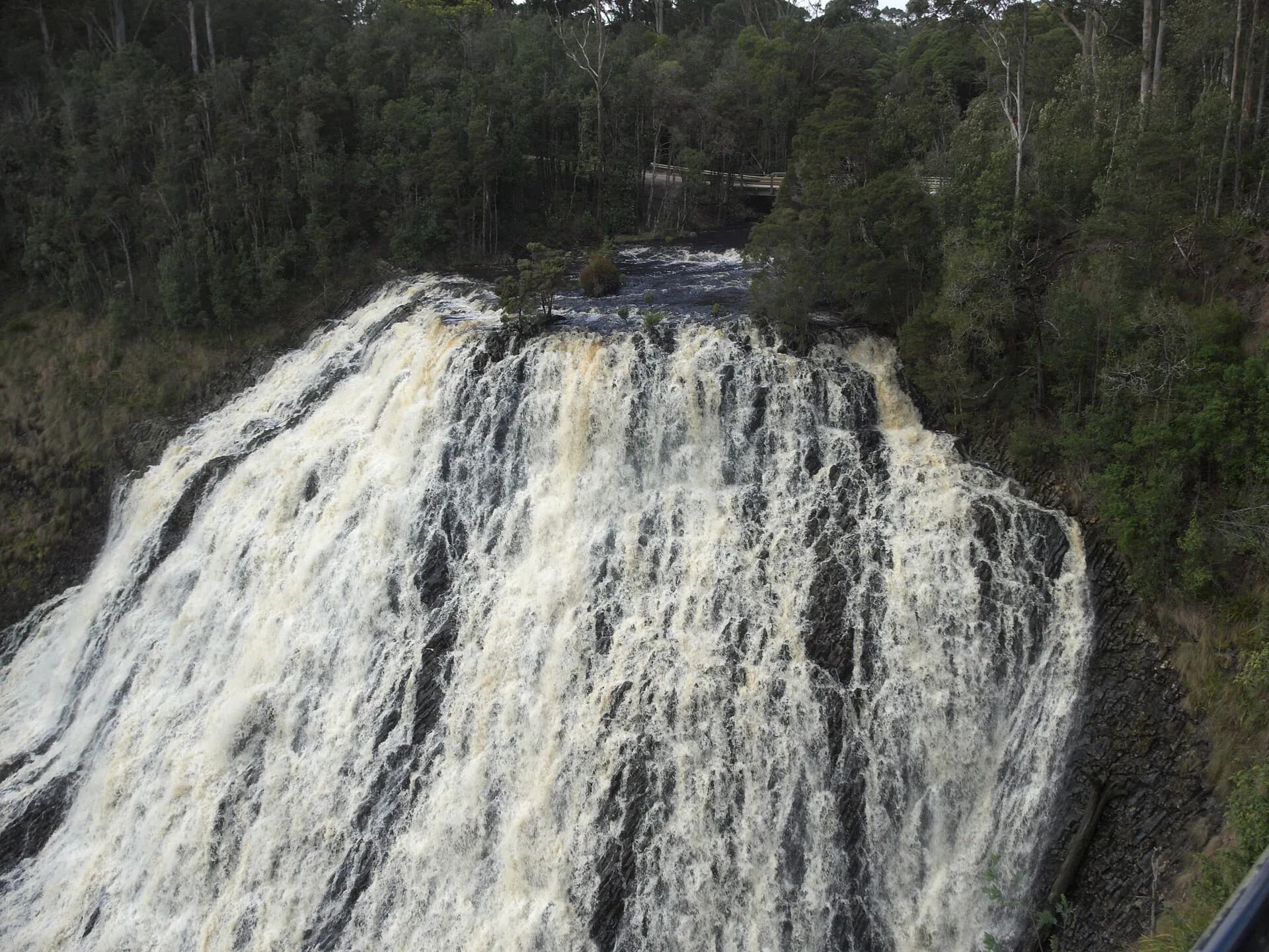 Dip Falls flowing over broad columnar rock