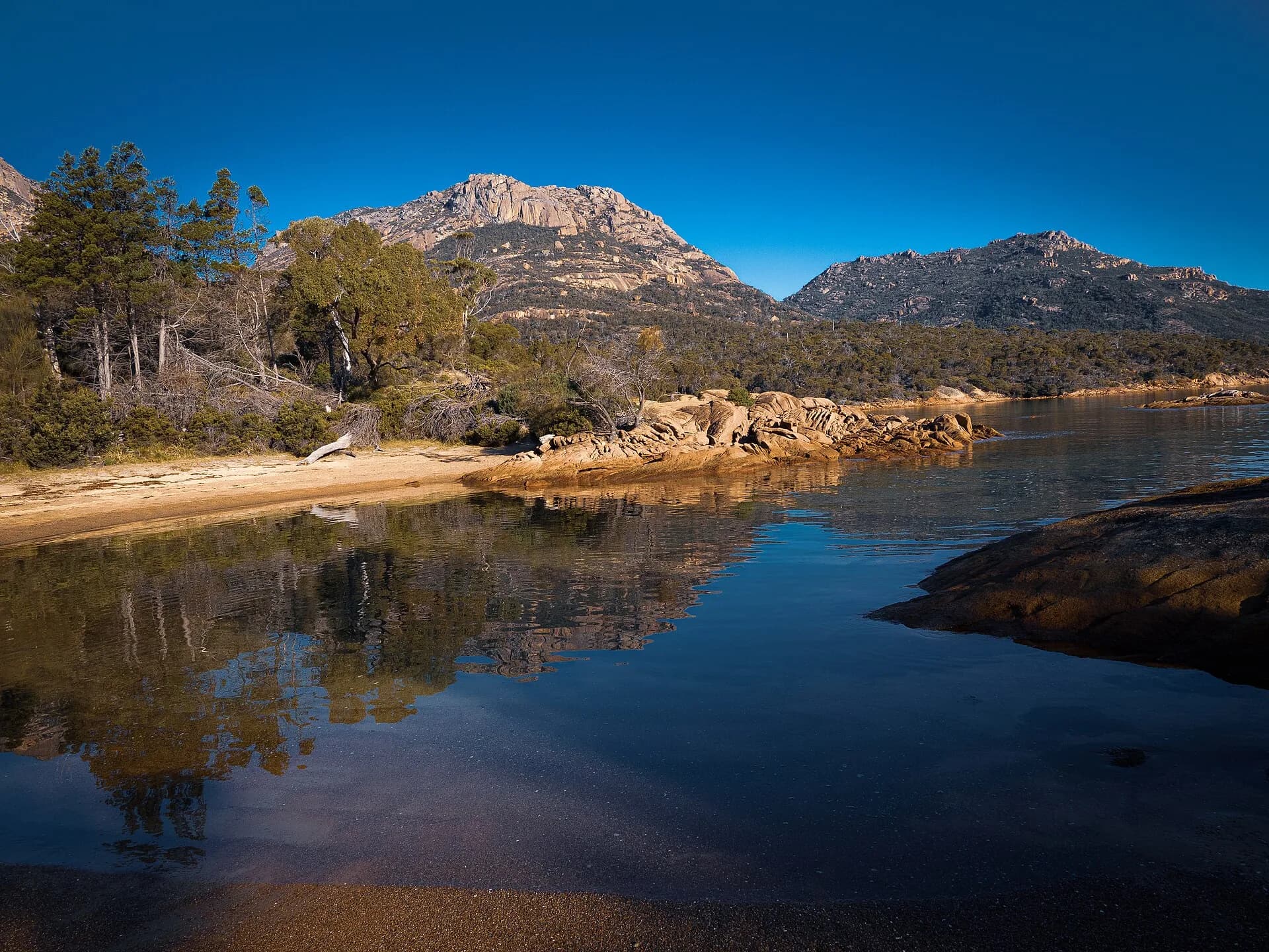 Long sandy beach and blue water on Tasmania’s East Coast