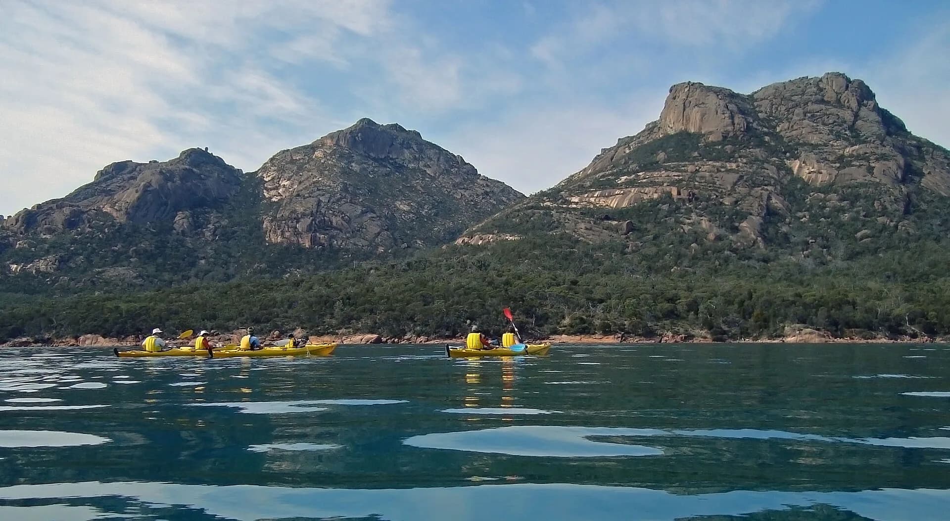 Sea kayakers paddling near Coles Bay on Tasmania’s east coast