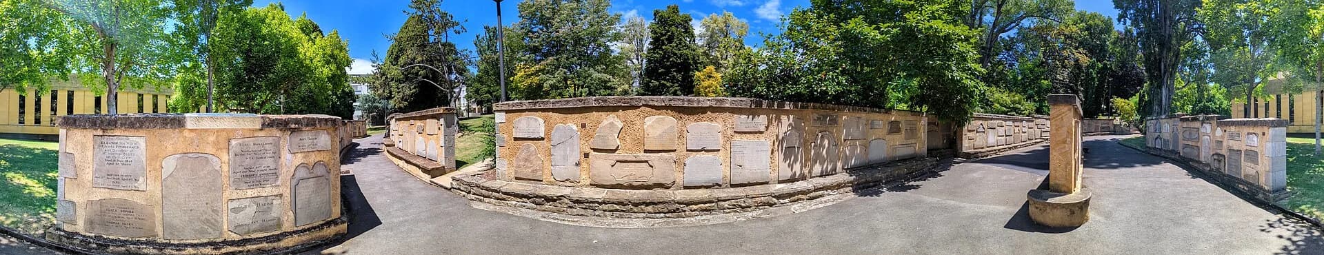 Historic headstones in the memorial wall at St David’s Park