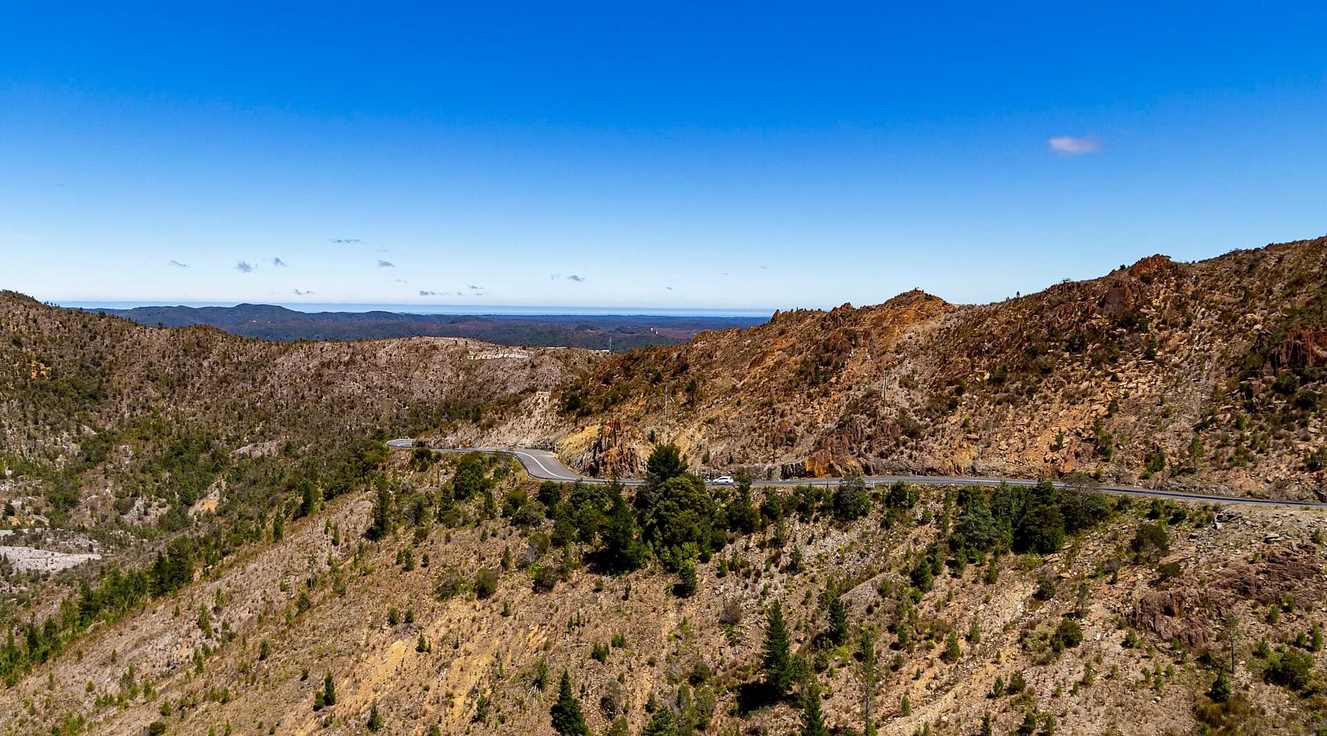 Lyell Highway winding through treeless West Coast mountain country