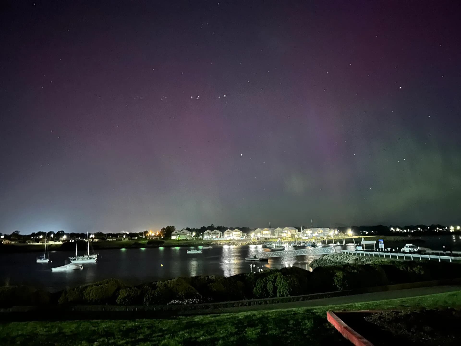 Aurora australis low above a dark Tasmanian horizon