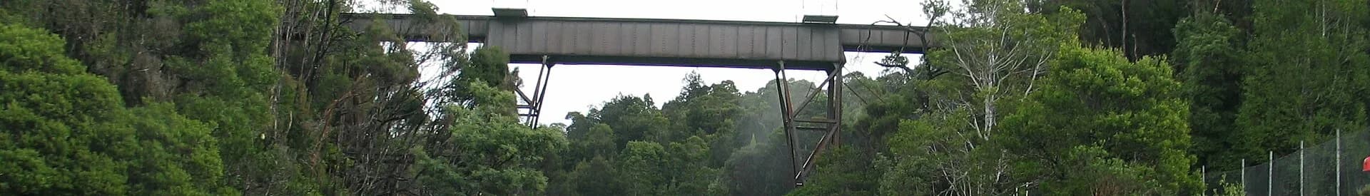 Rosebery beneath steep forested mountains