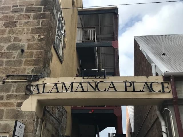 Salamanca Place street sign against sandstone buildings