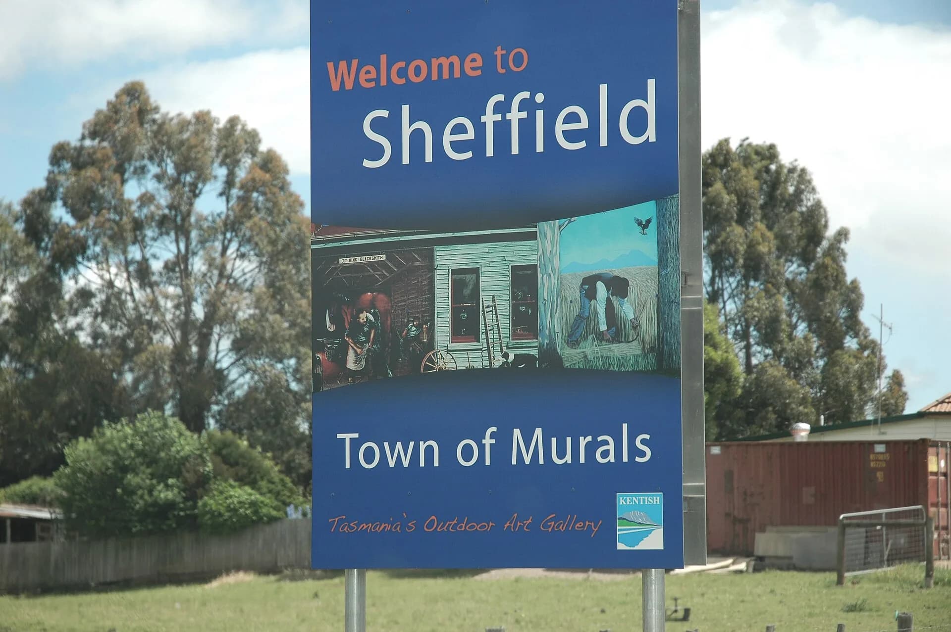Outdoor mural in Sheffield with rural buildings nearby