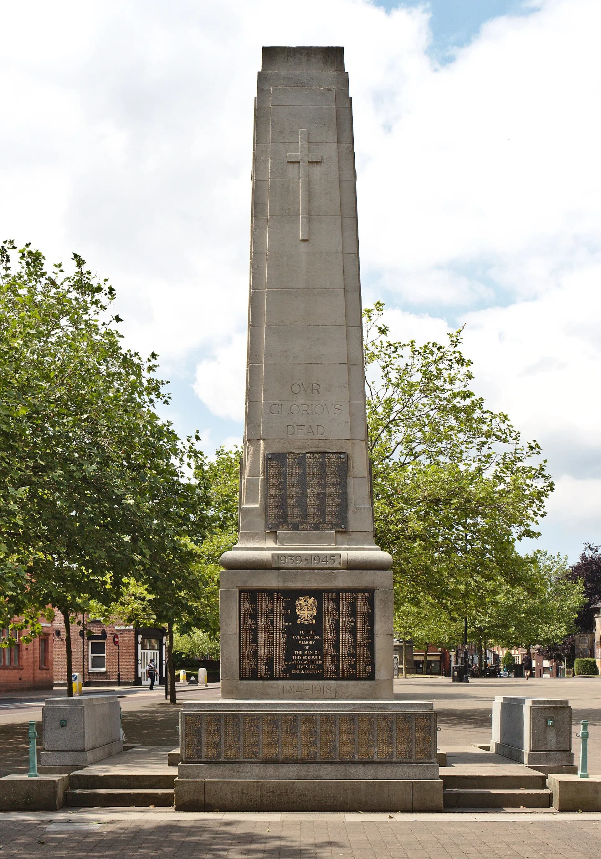 Stone war memorial and trees in central St Helens