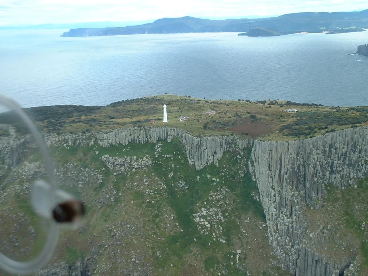 Tasman Island rising from the sea beyond Cape Pillar