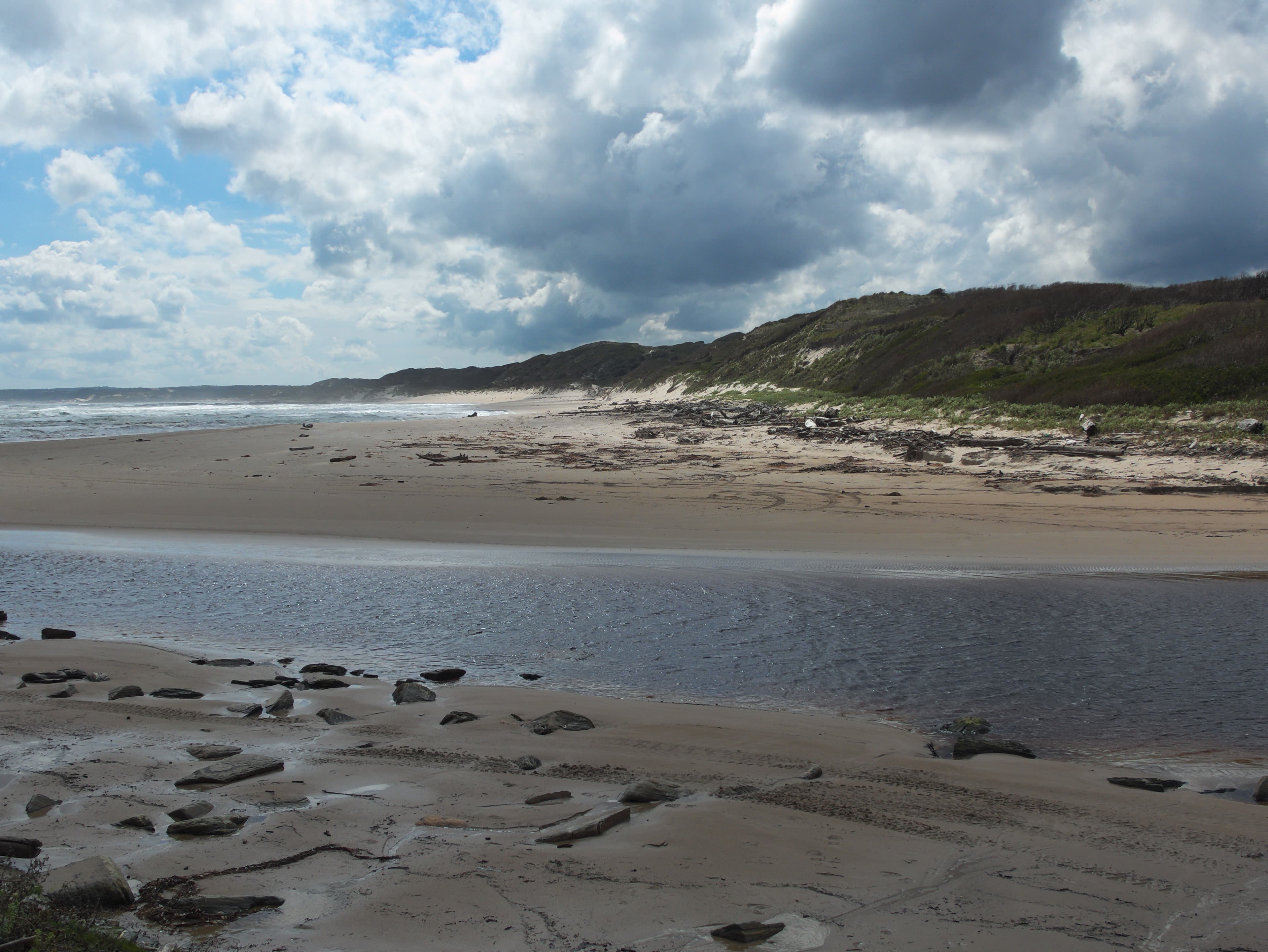 The mouth of Sundown Creek on the west coast of Tasmania, looking towards Sundown Point Beach.
